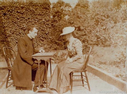 A family friend with the Catholic Chaplain. c.1910.